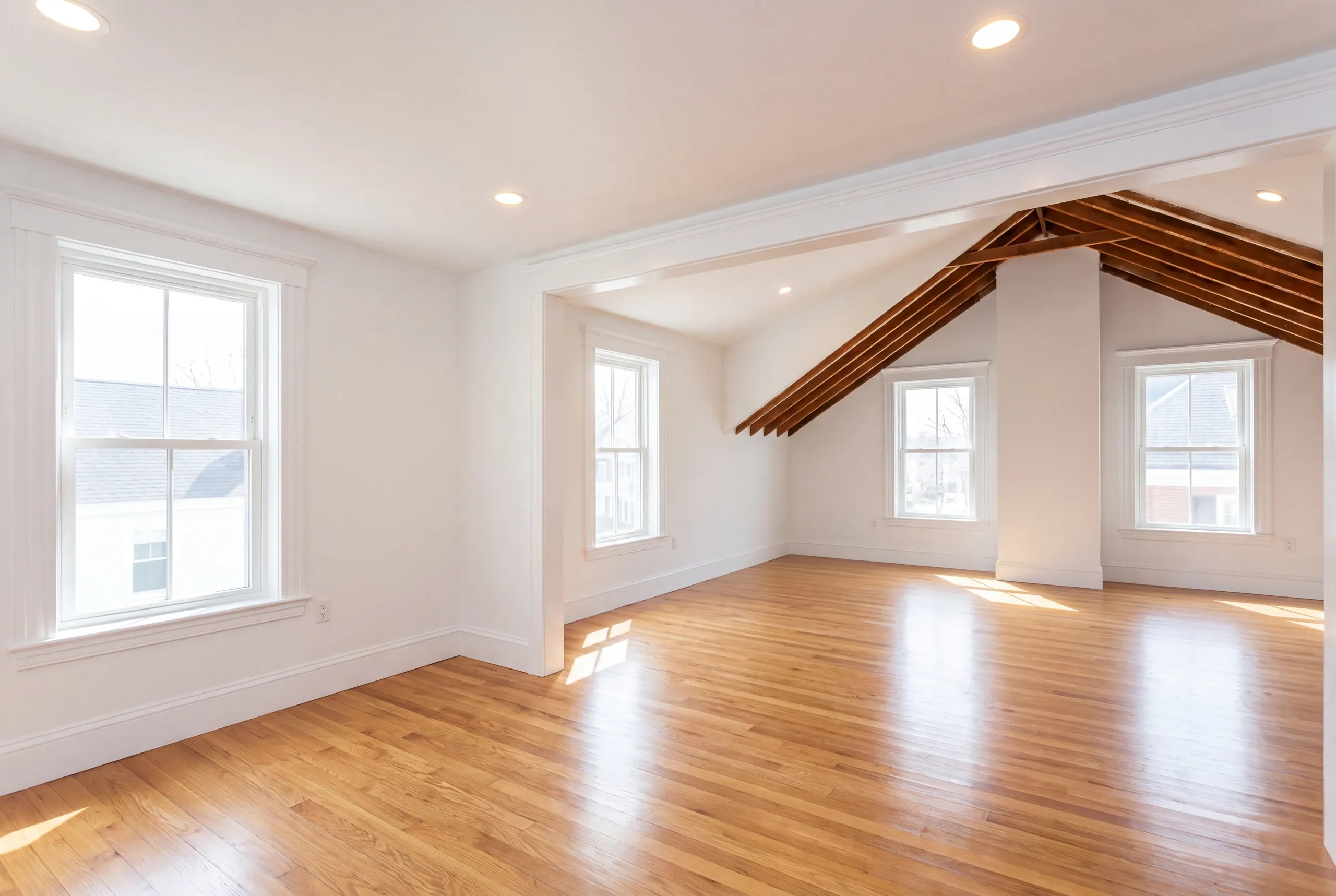 Home remodeling in Bath, ME finishing a third-floor room under a steep roof